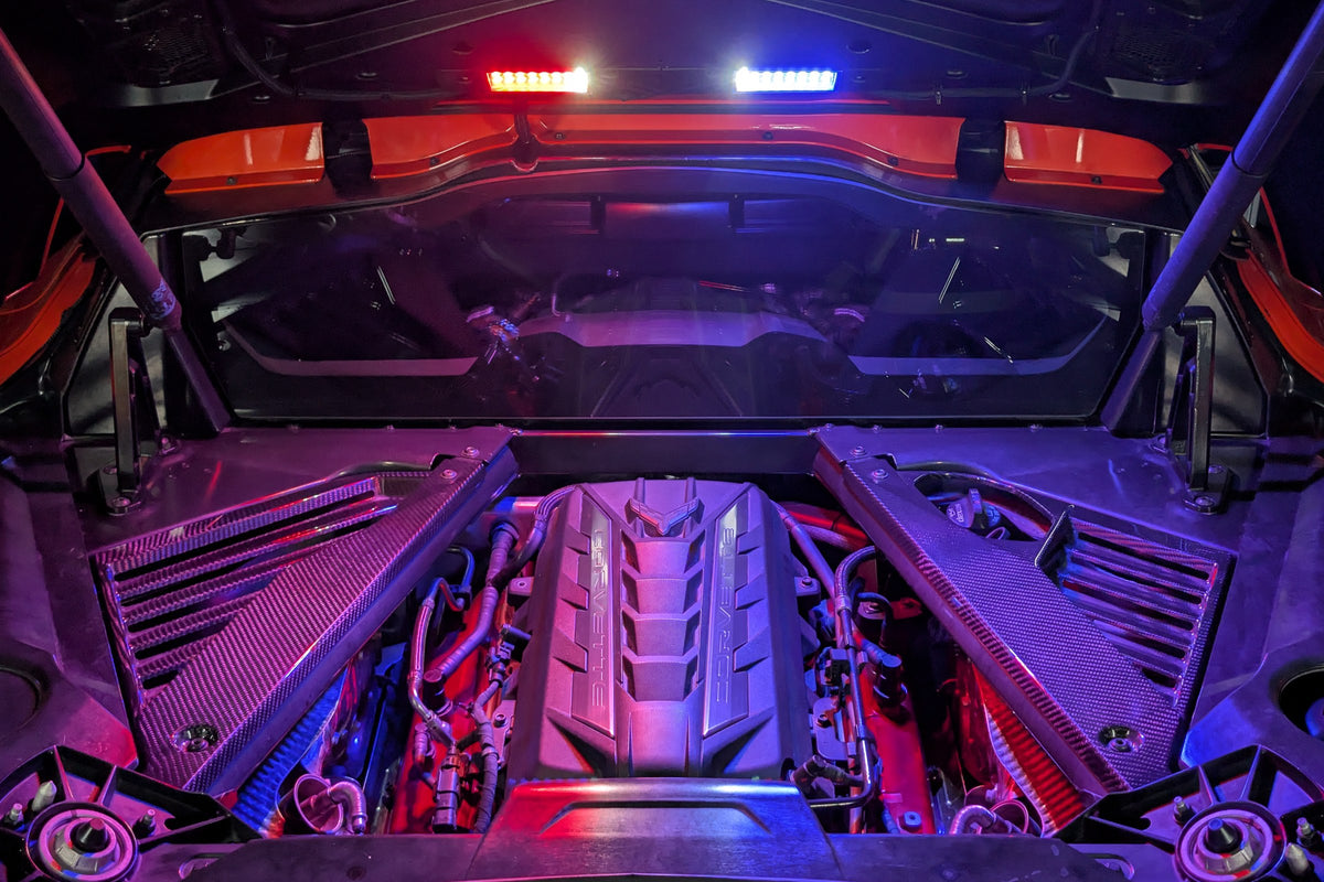 Corvette C8 engine bay lit in magenta by the Boosted Lighting Solutions Engine Bay Lighting Kit