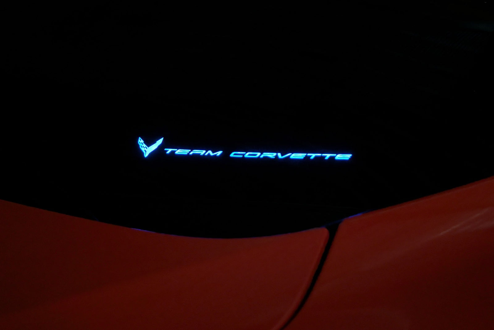 Team Corvette windshield emblem lit in cyan by the Boosted Lighting Solutions TeamCorvette LED