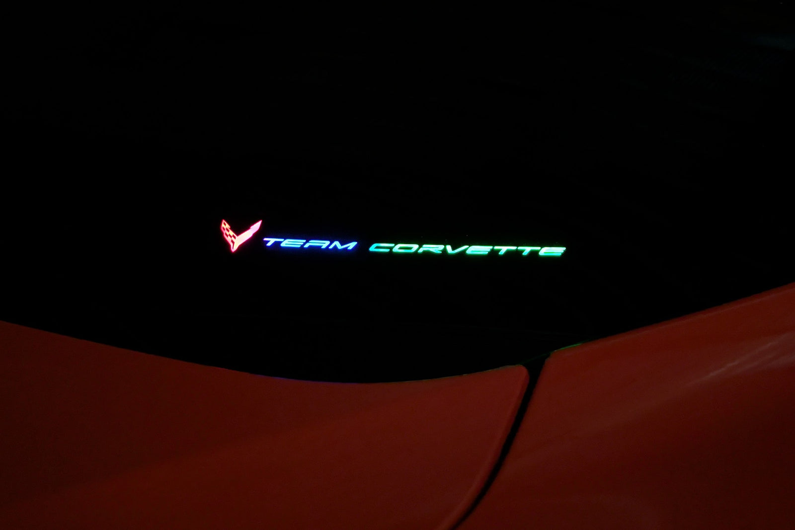 Team Corvette windshield emblem lit in multiple colours at once by the Boosted Lighting Solutions TeamCorvette LED