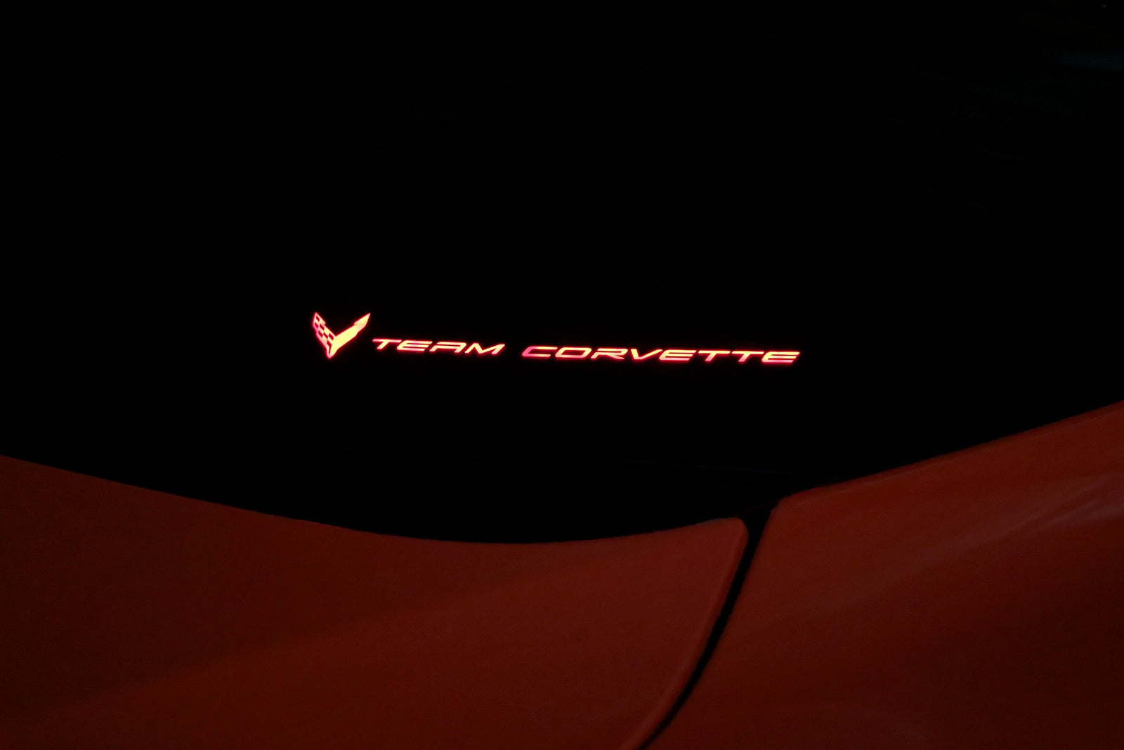 Team Corvette windshield emblem lit in red by the Boosted Lighting Solutions TeamCorvette LED