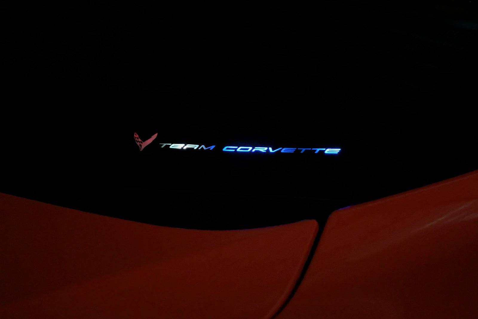 Team Corvette windshield emblem lit in violet by the Boosted Lighting Solutions TeamCorvette LED